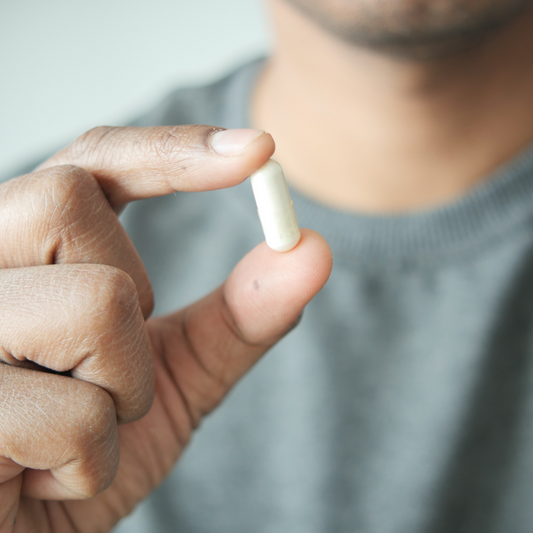 man holding a pill